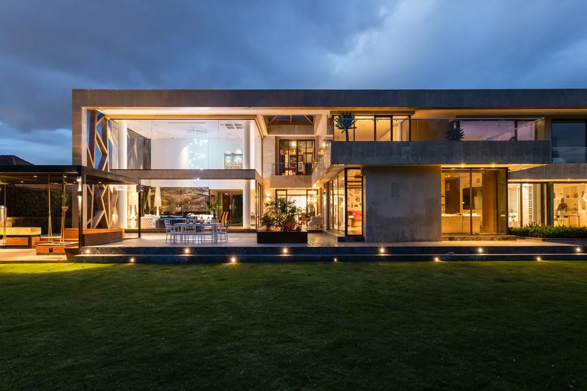 Glass-front villa at golden hour