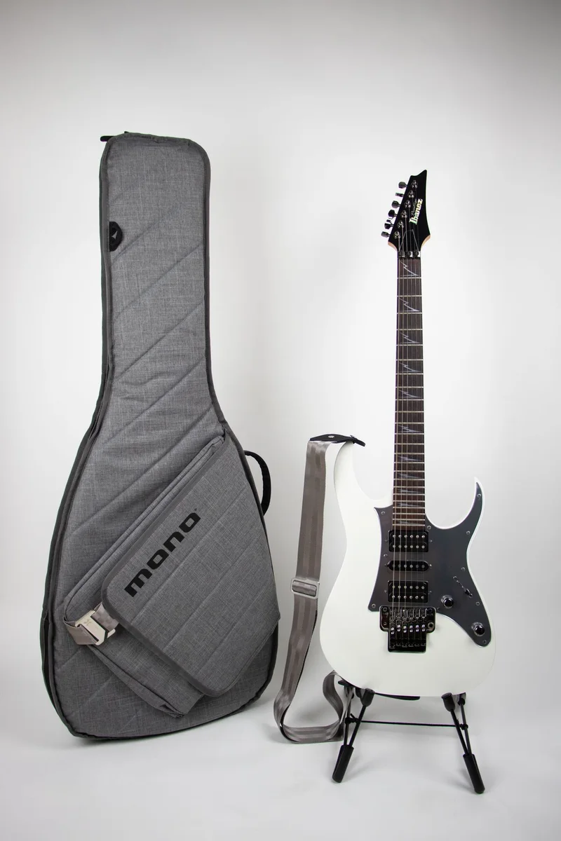 Black electric guitar with bag and stand