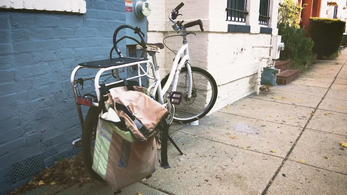 White city bicycle with rack and pannier